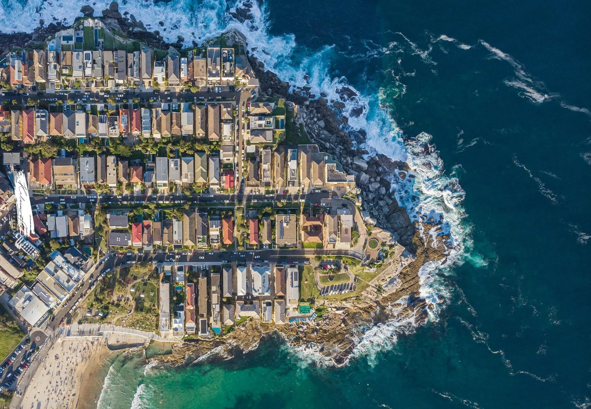 Aerial view of Sydney streets meeting the coastline